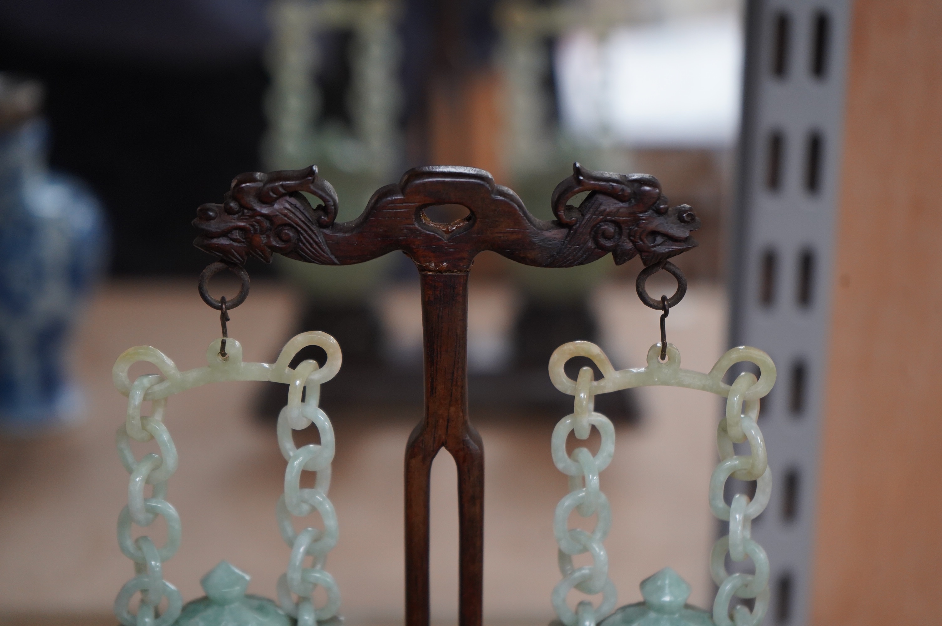 A pair of Chinese jadeite hanging baskets and covers, with original stand and hanging support, first half 20th century, 18cm high. Condition - good